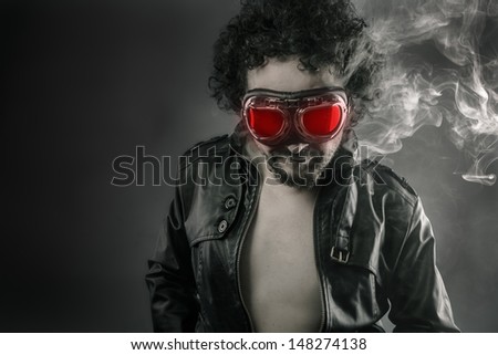 Man with leather jacket and smoke coming out of your body heat concept, sexy anger