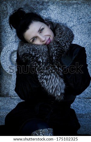 Elegant.Beautiful woman in winter.Beauty Fashion Model Girl in a Fur Hat. Russianl Stylish young.Portrait.