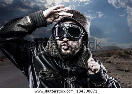 biker with black leather jacket and old glasses