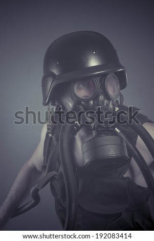 Survival, Man with black gas mask, pollution concept and ecological disaster