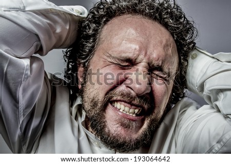 concern for the future, man with intense expression, white shirt