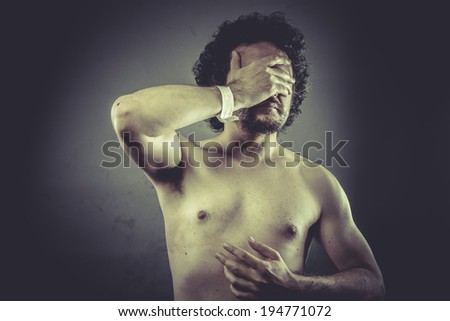 Concept medical, Nude Man with hospital bracelet.