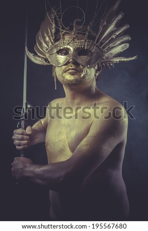 golden deity, man with wings and gold helmet