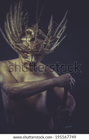 War, golden deity, man with wings and gold helmet
