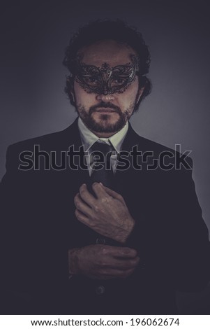 Confident, Portrait of elegant businessman, mysterious venetian mask