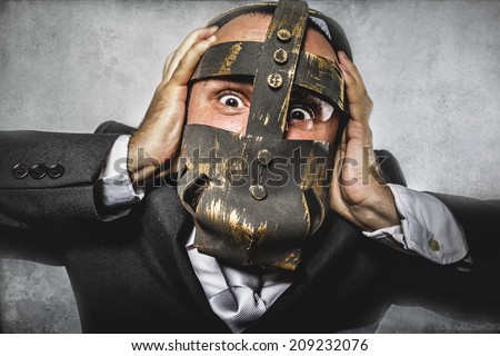 pulling, dangerous business man with iron mask and expressions