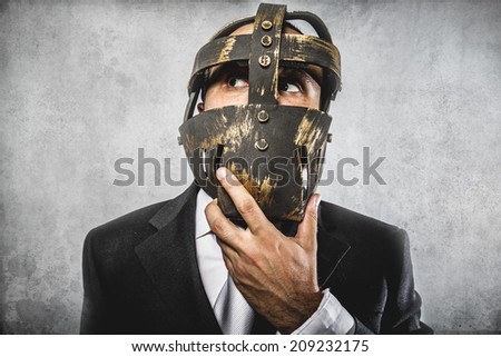 thinking, dangerous business man with iron mask and expressions