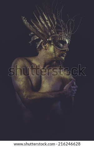 guy, golden bodypaint, man with gold helmet, ancient warrior deity