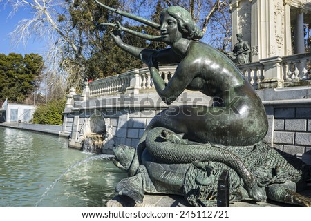bronze sculpture of a mermaid. Lake in Retiro park, Madrid Spain