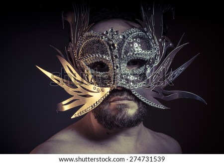 Theater, bearded man with silver mask Venetian style. Mystery and renaissance