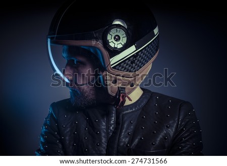 Freedom, biker with motorcycle helmet and black leather jacket, metal studs