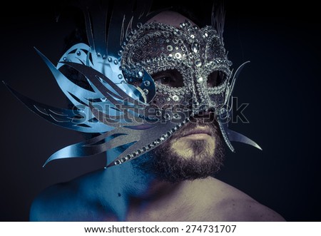 Ego, bearded man with silver mask Venetian style. Mystery and renaissance