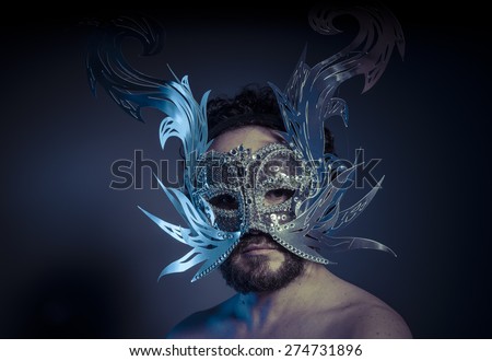 bearded man with silver mask Venetian style. Mystery and renaissance