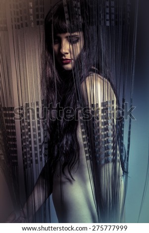 Seduce, naked girl behind curtains of black threads