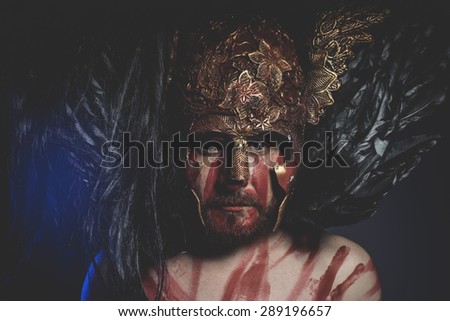 Mythology, bearded man warrior with metal helmet and shield, wild Viking