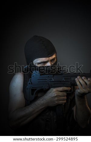 Bandit, Man wearing balaclavas and bulletproof vest with firearms
