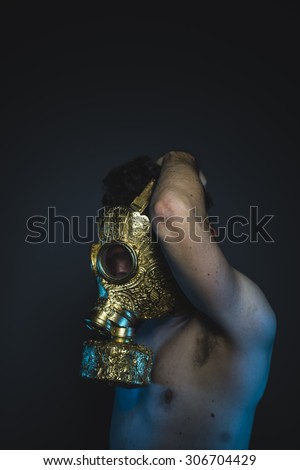 poisonous, depression and danger man with golden gas mask