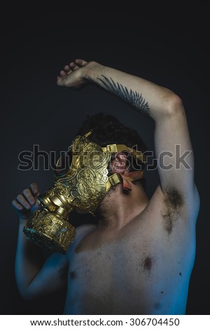 survivor, depression and danger man with golden gas mask