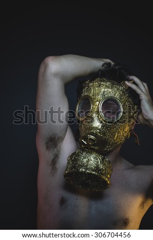 depression and danger man with golden gas mask