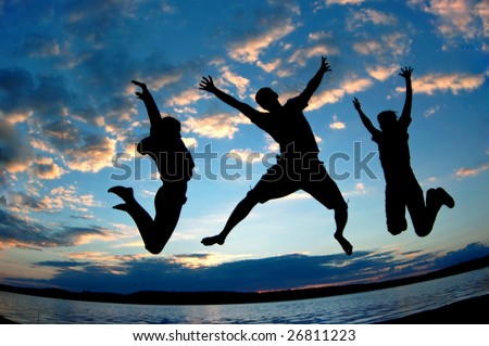 Three happy people jumping.