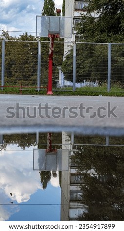 Similar – Foto Bild Basketballkorb reflektiert auf der Pfütze auf dem roten Boden