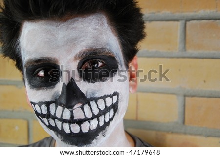 portrait of a creepy skeleton guy perfect for Carnival (brick wall background)