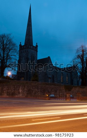 Saint James church in Mallow town, Ireland (sunset picture with car trails)