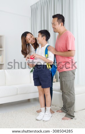 Asian parents get their children ready to school