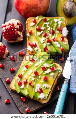 Avocado sandwich with feta and pomegranate