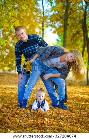 love, relationship, family, leisure, autumn - Happy family walking at the autumn nature
