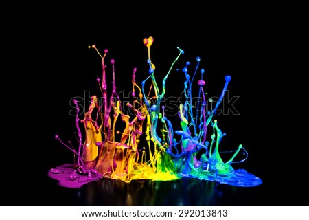 This is a colorful paint splash on a speaker isolated on a black background.