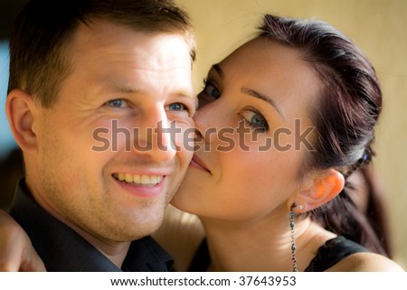 Portrait of a happy couple with vigneted dark corners and vintage sephia look