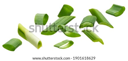 Falling green onion slices, fresh cut chives isolated on white background with clipping path