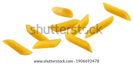 Falling italian penne rigate pasta isolated on white background with clipping path