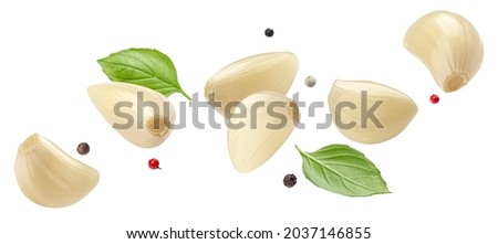 Falling peeled garlic cloves isolated on white background with clipping path Сток-фото © 