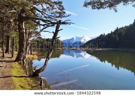 Similar – Image, Stock Photo 1600 | Mountain lake with clouds hanging low in the mountain