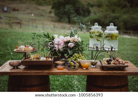 Similar – Image, Stock Photo Wedding candy bar table. Cakes with cream and berries and other sweets. High quality photo