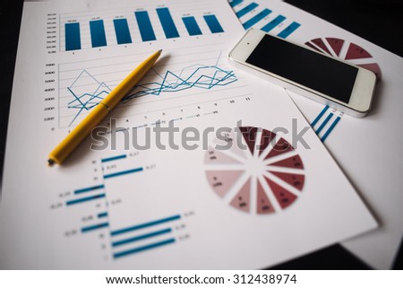 financial and business color charts and graphs on the table