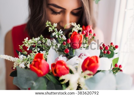 Similar – Image, Stock Photo Woman smells red tulips