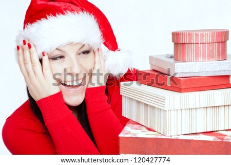surprised christmas brunette woman with presents