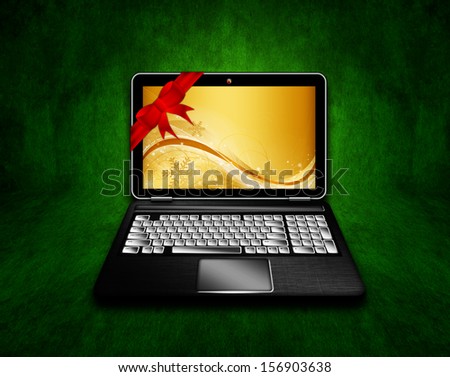laptop with christmas background and place for text over dark green