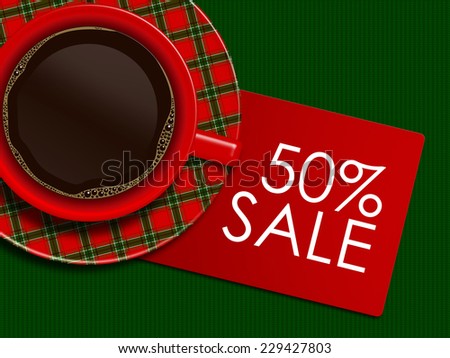 checkered christmas coffee with discount card lying on green tablecloth