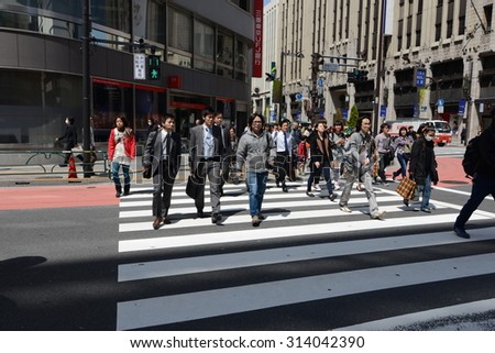 TOKYO - CIRCA APRIL 2013: people at the crosswalk in Shinjuku district in Tokyo, Japan circa April 2013.