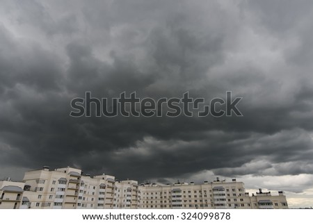 MOSCOW - CIRCA JUNE 2015: dark clouds in the sky above the block of flats in summer time in Moscow, Russia.