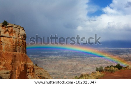 Bright rainbow over Grand Junction  Colorado from National Monument Park