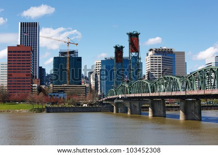 Portland City Green Steel Bridge and skyline with construction crane