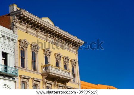 Yellow Gold Rush building in Old town Sacramento with blue sky