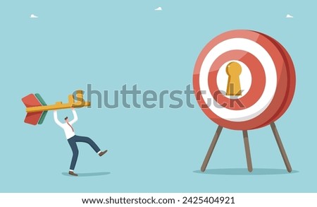 Teamwork to achieving business goals, motivation and determination for great success, find the key to achieve excellence in work and career growth, man throws a key-shaped dart at a dart board.