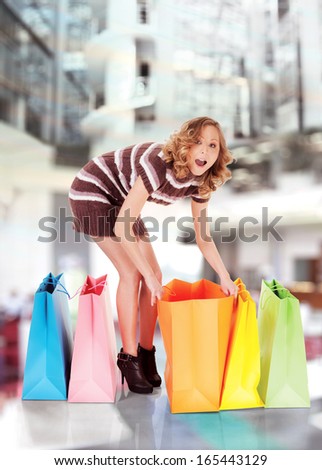 happy smiling woman shopping, background digitally added, work path