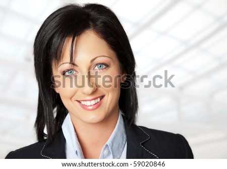 Portrait of beautiful young woman with blue eyes smiling